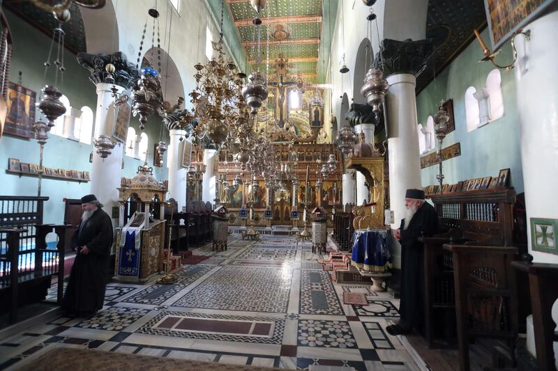 Greek monks stand inside a church at Saint Catherine's monastery in Sacred Valley, South Sinai. EPA