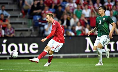 Soccer Football - International Friendly - Denmark v Mexico - Broendby Stadium - Copenhagen, Denmark - June 9, 2018. Christian Eriksen of Denmark passes Carlos Salcedo of Mexico to score a goal. Ritzau Scanpix/Lars Moeller via REUTERS ATTENTION EDITORS - THIS IMAGE WAS PROVIDED BY A THIRD PARTY. DENMARK OUT. NO COMMERCIAL OR EDITORIAL SALES IN DENMARK