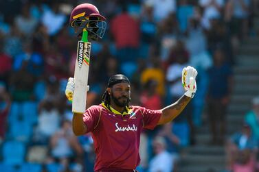 Chris Gayle of West Indies celebrates his half century during the fifth and final ODI against England in Saint Lucia. AFP
