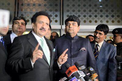 Interior Minister of Pakistan Rehman Malik (L) gestures while speaking after arriving at an Indian Air Force station as Indian Kunwar Ratanjit Pratap Narain Singh (2R),  Minister of State in Home Affairs looks on  in New Delhi on December 14, 2012. Pakistan's interior minister flew to India to launch a new agreement aimed at lowering hurdles in cross-border travel between the two nuclear-armed rival countries, officials said. AFP PHOTO/ Prakash SINGH (Photo by PRAKASH SINGH / AFP)