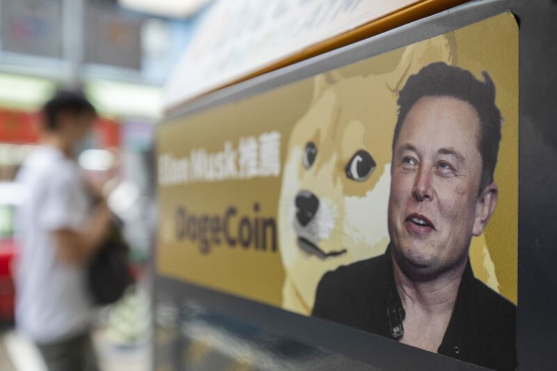 A sticker advertising Dogecoin on a cryptocurrency ATM with Elon Musk on it. Bloomberg