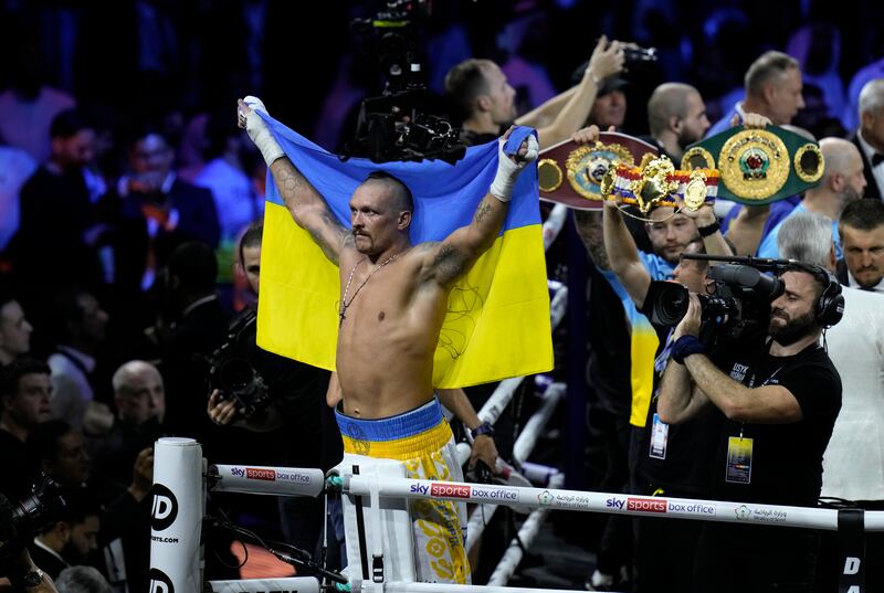 Ukraine's Oleksandr Usyk celebrates his win on Saturday. AP