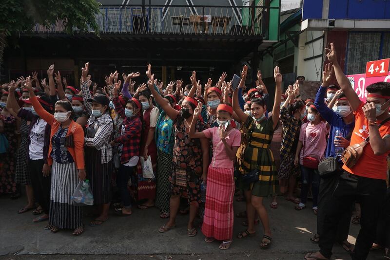 Protesters give the three-finger salute during a demonstration against the military coup in Yangon.  AFP