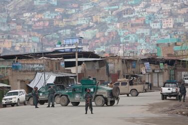 Afghan police guard the site of an attack on a Sikh temple in Kabul's old city on March 25, 2020. AP