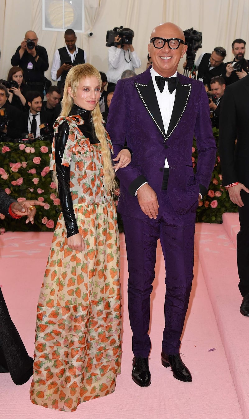 Fittingly for the CEO and President of Gucci, Marco Bizzarri donned a purple suit, picked out with silver beading. Petra Collins meanwhile, wore Gucci SS19. AFP