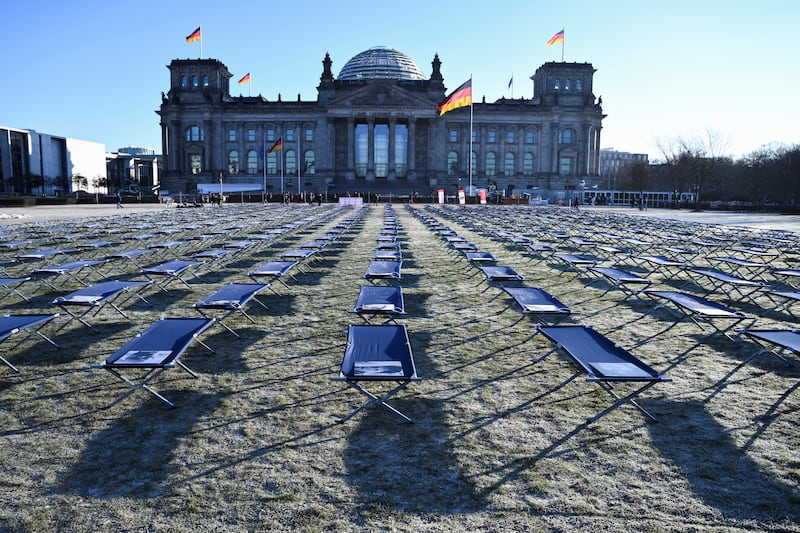A protest against the expansion of Covid-related biomedical research at the Reichstag building in Berlin. Reuters