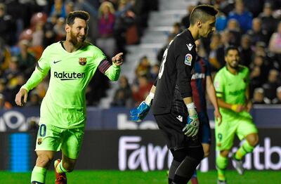 Barcelona's Argentinian forward Lionel Messi celebrates after scoring a goal during the Spanish League football match between Levante and Barcelona at the Ciutat de Valencia stadium in Valencia on December 16, 2018. / AFP / JOSE JORDAN
