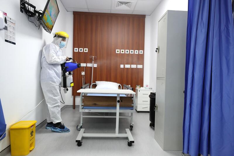 Abdulaziz disinfects a ward during a visit to the SEHA field hospital for Covid-19 patients in Ajman on April 25th, 2021. Chris Whiteoak / The National. 
Reporter: Kelly Clarke for News