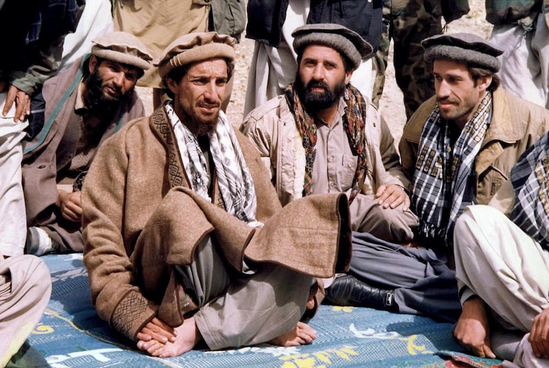 (FILES) - File photo taken 12 October 1990 in Sho-E-Salim of Afghan opposition commander Ahmad Shah Masood (2ndL) talking with aides. French Foreign Minister Hubert Vedrine said 14 September 2001 that "it appears to be confirmed that commander Ahmad Shah Masood, the head of the Afghan opposition, has died". AFP PHOTO (Photo by AFP)