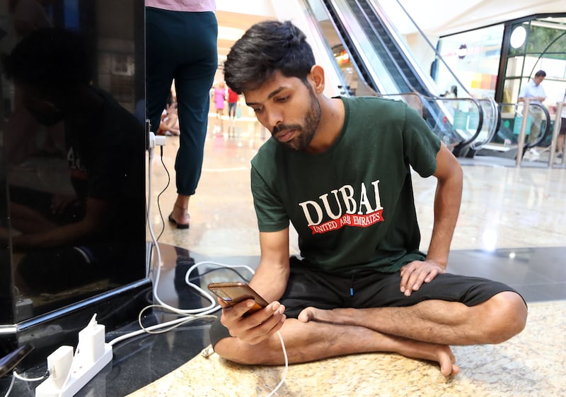 People are charging their devices at Mall of the Emirates as their homes are still affected by power cuts