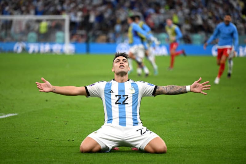 Lautaro Martinez celebrates after scoring the winning penalty for Argentina. Getty