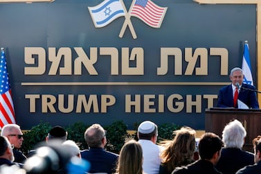Israeli Prime Minister Benjamin Netanyahu gives a speech before the newly-unveiled sign for the new settlement of "Ramat Trump", or "Trump Heights" in English, named after the incumbent US President during an official ceremony in the Israeli-annexed Golan Heights on June 16, 2019. AFP