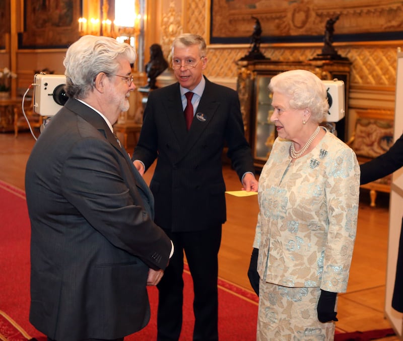 Queen Elizabeth meets 'Star Wars' director George Lucas at Windsor Castle. Getty