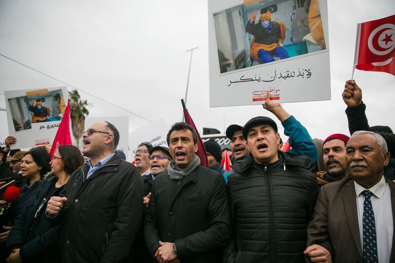 Tunisian politician Jaouhar Ben Mbarek, centre, during a protest. He is facing charges of conspiring against state security. AP