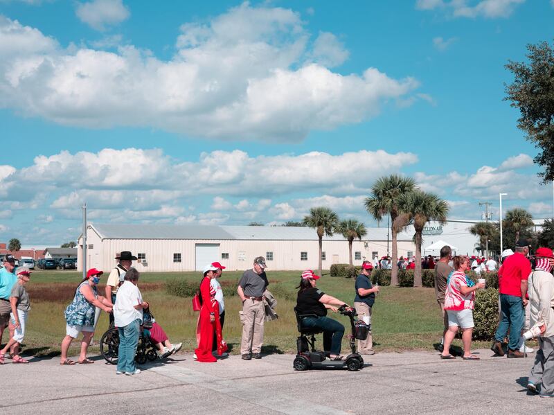 Attendees stand in line before a campaign rally with U.S. President Donald Trump in Sanford, Florida. Bloomberg