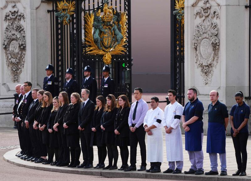 Buckingham Palace household staff pay their respects. AFP