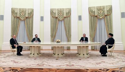 Russian President Vladimir Putin, left, and Iranian President Ebrahim Raisi, right, hold talks in Moscow last week. EPA
