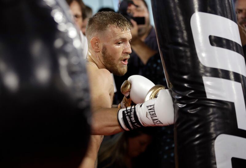 File- This Aug. 11, 2017, file photo shows Conor McGregor training during a media workout in Las Vegas. Look at any boxing website, and the comments will largely all be the same. Floyd Mayweather Jr.'s fight with McGregor is a joke, a spectacle that has little to do with real boxing. No reason to spend two cents on it, much less $100, when there's a real super fight coming up a few weeks later between Gennady Golovkin and Canelo Alvarez. (AP Photo/John Locher, File)