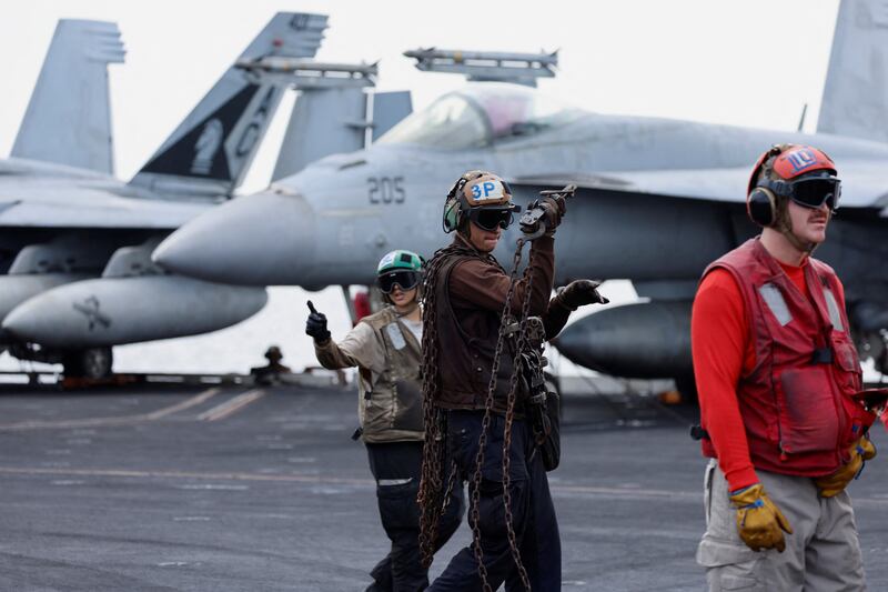 A flight deck crew on US aircraft carrier USS Dwight D Eisenhower in the Red Sea. Reuters