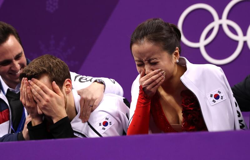 Yura Min and Alexander Gamelin of Korea react after competing during the Figure Skating Ice Dance Short Dance. Richard Heathcote / Getty Images