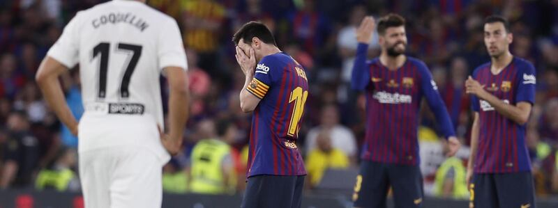 Lionel Messi, left, cannot hide his emotions as Barcelona fall to defeat. EPA
