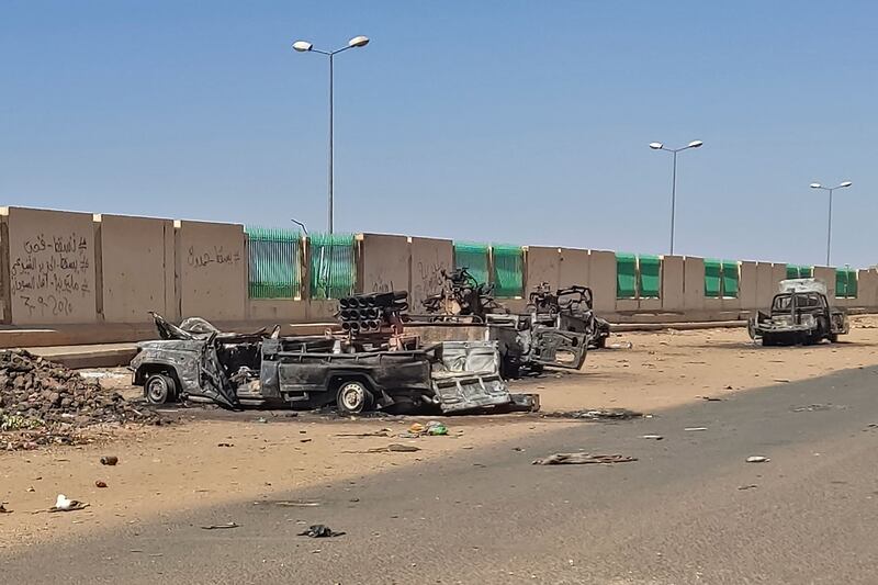 Vehicles destroyed during fighting in southern Khartoum. AFP