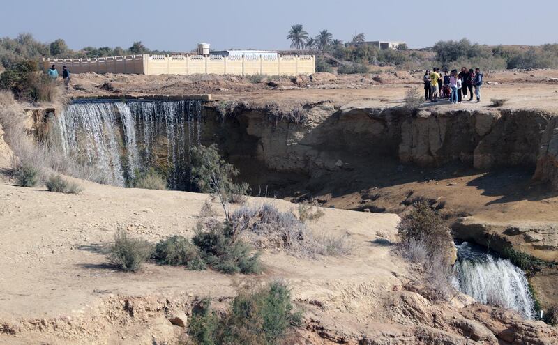 People visit the waterfalls at the Wadi Al Rayan nature preserve in Egypt. EPA