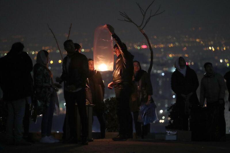 Iranians release a wishing lantern ahead of the traditional fire feasts  in Tehran, Iran. EPA