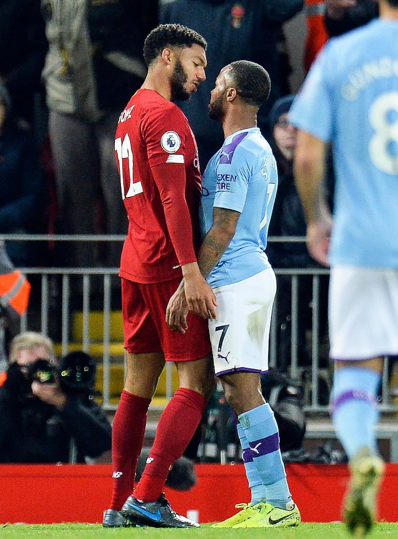 Joe Gomez  of Liverpool and Raheem Sterling face off during the Premier League match at Anfield. EPA