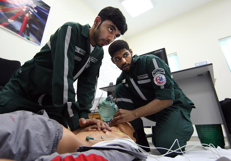 April 28, 2008 / Abu Dhabi / Adel al Yammahi, left, 23, and Asim Ali al Humoudi, 23, both training to be paramedics with the Emergency and Public Safety Department Ambulance section perform CPR on a dummy during a training session in Abu Dhabi April 28, 2008. (Sammy Dallal / The National) *** Local Caption *** SD-emer2.jpg