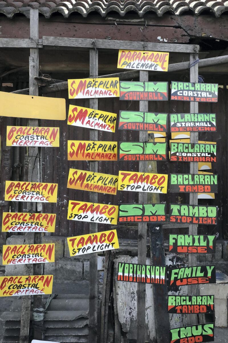 Paberecio sells four or five sign-boards on good days, at 25 Philippine pesos each. Jake Verzosa