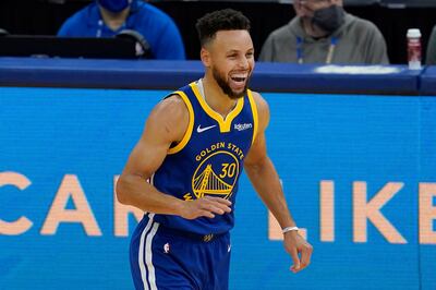 Golden State Warriors guard Stephen Curry celebrates after scoring against the Cleveland Cavaliers during the first half of an NBA basketball game in San Francisco, Monday, Feb. 15, 2021. (AP Photo/Jeff Chiu)