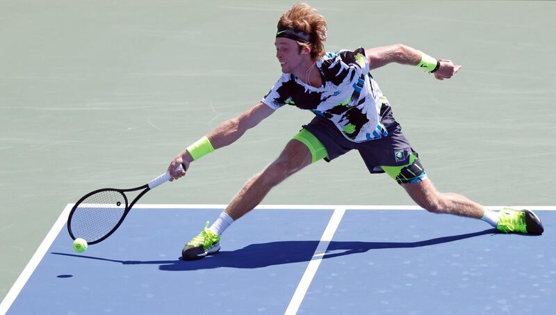 Andrey Rublev reaches for the ball during his first round match at the Western and Southern Open against Daniel Evans. EPA