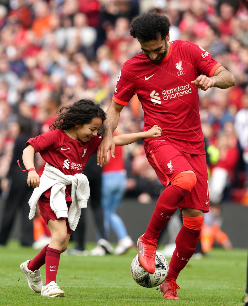 Mohamed Salah plays football with his daughter Makka Mohamed Salah at Anfield. PA