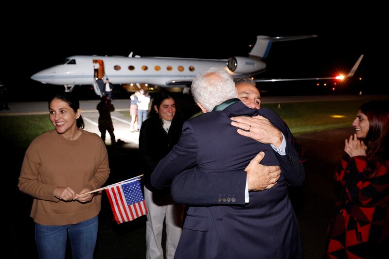Family members embrace freed Americans Siamak Namazi, Morad Tahbaz and Emad Shargi — as well as two returnees whose names have not yet been released by the U. S.  government — who were released in a prisoner swap deal between U. S and Iran, as they arrive at Davison Army Airfield at Fort Belvoir, Virginia, U. S. , September 19, 2023.  REUTERS / Jonathan Ernst / Pool