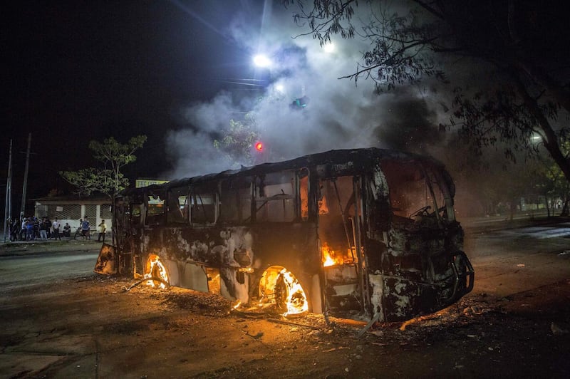 A burning bus during a protest in Managua, Nicaragua. Jorge Torres / EPA
