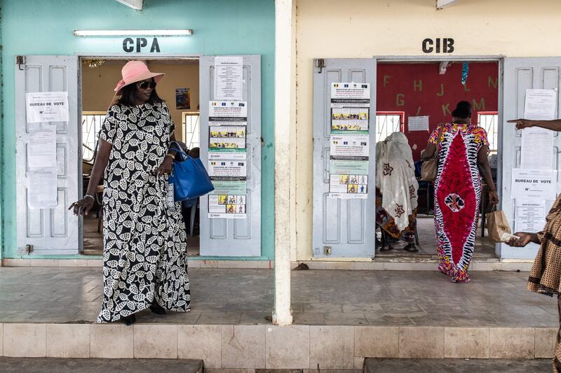 A woman leaves a voting station in Ngor, Dakar, on July 31, 2022. Senegalese voters head to the polls for parliamentary elections that the opposition hopes will force a coalition with President Macky Sall. AFP