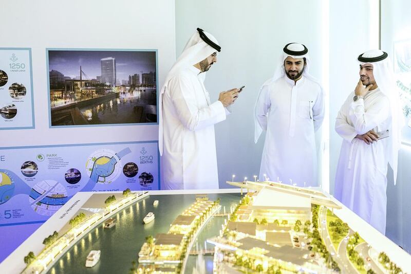 Visitors take a look at the scaled version of the Dh1 billion Marasi Business Bay. Reem Mohammed / The National