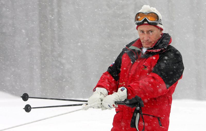 A snowmobile pulls Putin as he visits a mountainside of Sochi resort on February 20, 2007. AFP