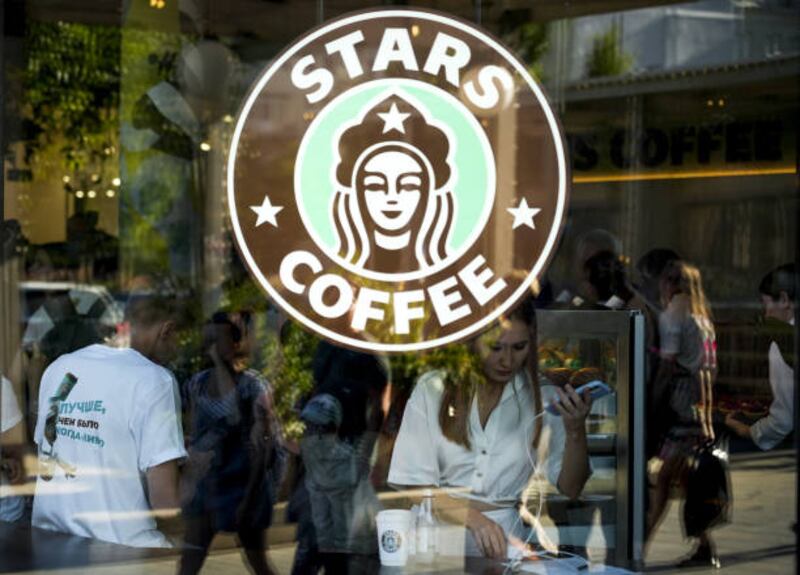 MOSCOW, RUSSIA - AUGUST 18: The Stars Coffee logo is seen on a window after former Starbucks coffee shops are reopened as Stars Coffee in Moscow, Russia on August 18, 2022. The rebranded coffee shops are owned by Russian businessman Anton Pinskiy and Russian rapper Timur Yunusov, known as Timati. Starbucks suspended its businesses in Russia in March, and pulled out of the country in May. (Photo by Dmitry Korotaev / Anadolu Agency via Getty Images)
