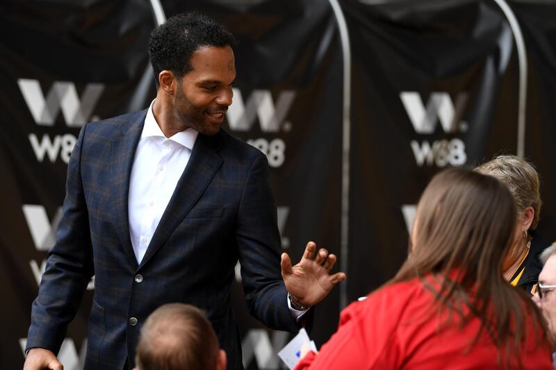 WOLVERHAMPTON, ENGLAND - AUGUST 25: Former Wolverhampton Wanderers and Manchester City defender Joleon Lescott speaks to fans as he arrives at the stadium prior to the Premier League match between Wolverhampton Wanderers and Manchester City at Molineux on August 25, 2018 in Wolverhampton, United Kingdom.  (Photo by Stu Forster/Getty Images)