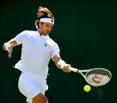LONDON, ENGLAND - JULY 01: Feliciano Lopez of Spain plays a forehand in his Men's Singles first round match against Marcos Giron of The United States during Day one of The Championships - Wimbledon 2019 at All England Lawn Tennis and Croquet Club on July 01, 2019 in London, England. (Photo by Mike Hewitt/Getty Images)