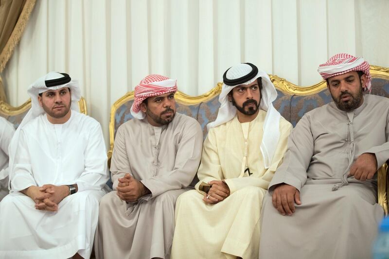 RAS AL KHAIMAH, UNITED ARAB EMIRATES -January 25, 2018: HH Sheikh Khalifa bin Tahnoon bin Mohamed Al Nahyan, Director of the Martyrs' Families' Affairs Office of the Abu Dhabi Crown Prince Court (2nd R), offers condolences to the family of martyr Abdullah Al Dahmani, who passed away while serving the the UAE Armed Forces in Yemen. 

(  Mohamed Al Baloushi for the Crown Prince Court - Abu Dhabi  )

---