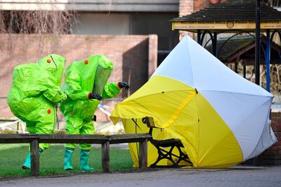 (FILES) In this file photo taken on March 08, 2018 Members of the emergency services in green biohazard encapsulated suits afix the tent over the bench where a man and a woman were found on March 4 in critical condition at The Maltings shopping centre in Salisbury, southern England, on March 8, 2018 after the tent became detached. 
The world's chemical arms watchdog on April 12, 2018 confirmed Britain's findings that a nerve agent used in an attack on former spy Sergei Skripal and his daughter Yulia in England last month originally came from Russia. Blood samples tested by the Organisation for the Prohibition of Chemical Weapons (OPCW) "confirm the findings of the United Kingdom relating to the identity of the toxic chemical," according to a summary of the Hague-based group's report released in London.
 / AFP PHOTO / Ben STANSALL