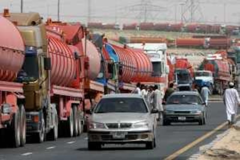 DUBAI, UNITED ARAB EMIRATES – May 4: Sewage water tankers waiting for their turn near the Al-Aweer sewage treatment plant in Dubai. (Pawan Singh / The National) For news. Story by Praveen *** Local Caption ***  PS04- SEWAGE TANKERS.jpg