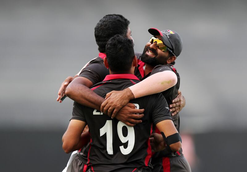 UAE's Junaid Siddique celebrates taking the wicket of Nepal's Karan KC during their Cricket World Cup League 2 match at Dubai International Stadium on March 18, 2022. All photos Chris Whiteoak / The National