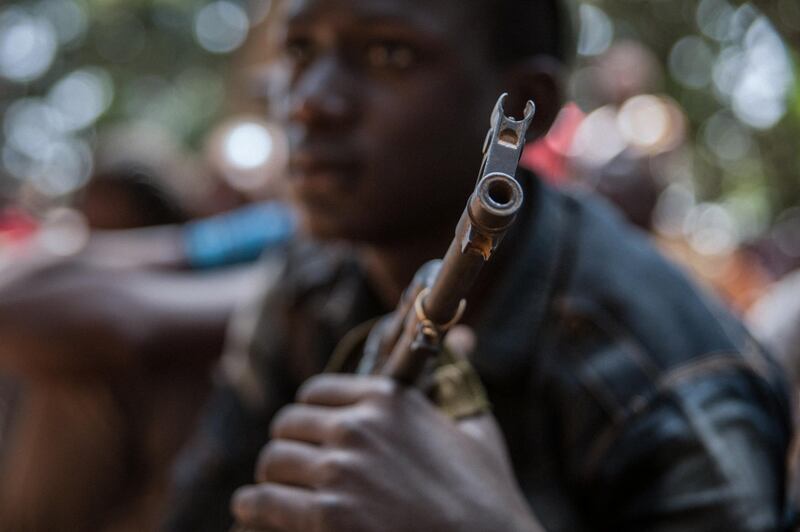 A newly released child soldier attends a release ceremony in Yambio, South Sudan, on February 7, 2018. - More than 300 child soldiers, including 87 girls, have been released in South Sudan's war-torn region of Yambio under a programme to help reintegrate them into society, the UN said on on Februar y 7, 2018. A conflict erupted in South Sudan little more than two years after gained independence from Sudan in 2011, causing tens of thousands of deaths and uprooting nearly four million people. The integration programme in Yambio, which is located in the south of the country, aims at helping 700 child soldiers return to normal life. (Photo by Stefanie Glinski / AFP)