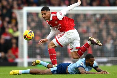 LONDON, ENGLAND - FEBRUARY 11:  William Saliba of Arsenal battles for possession with Ivan Toney of Brentford during the Premier League match between Arsenal FC and Brentford FC at Emirates Stadium on February 11, 2023 in London, England. (Photo by Shaun Botterill / Getty Images)
