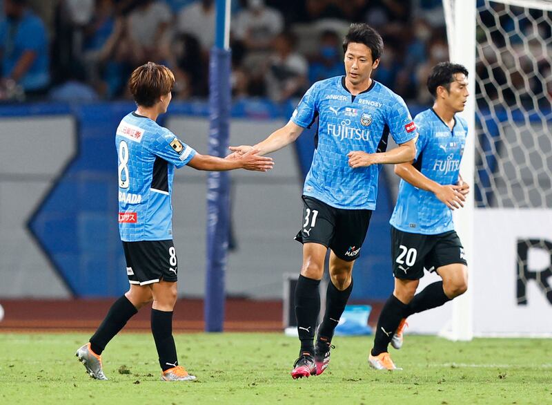 Kawasaki Frontale's Kazuya Yamamura celebrates scoring  with Kento Tachibanada. Reuters