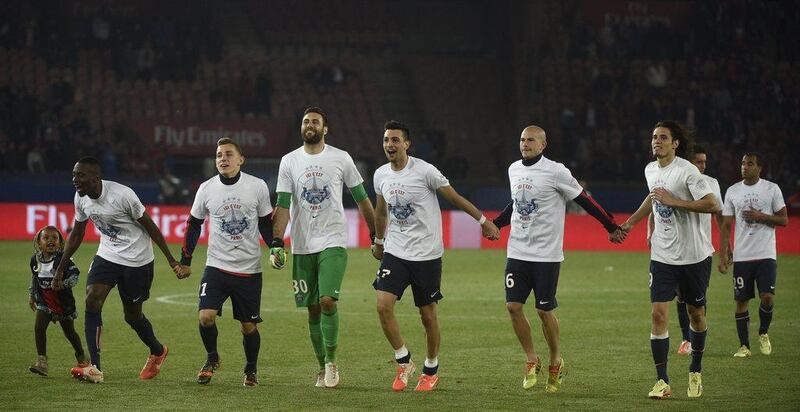 Paris Saint-Germain players celebrate after their match against Rennes, which proved inconsequential, at the Parc Des Princes in Paris on Wednesday. PSG lost 2-1, but won the Ligue 1 title for the second successive season thanks to an earlier Monaco draw. Martin Bureau / AFP / May 7, 2014